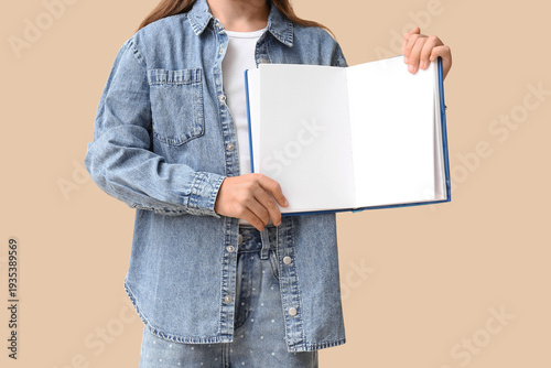 Cute little girl holding op...