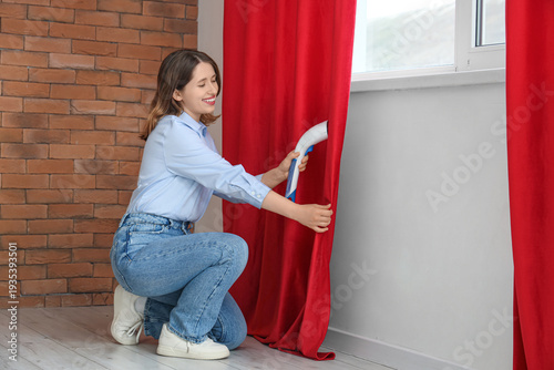 Young woman steaming red cu...