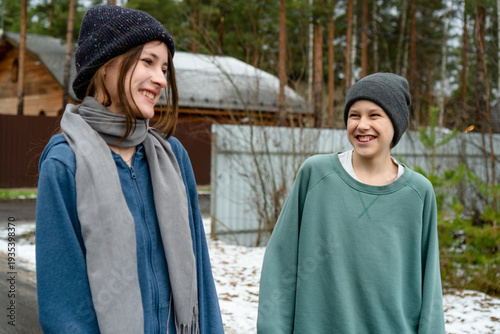 Obraz na plátně A teenage brother and sister burst into laughter while talking after a jog