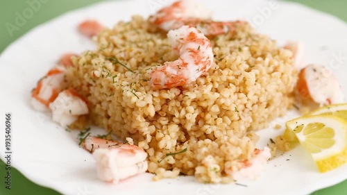 healthy bulgur with shrimp and lemon garnish