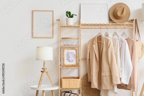 Wooden rack with stylish cl...