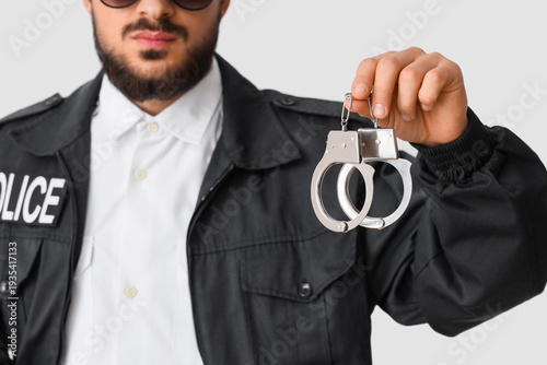 Male police officer with ha...