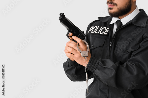 Male police officer with gu...