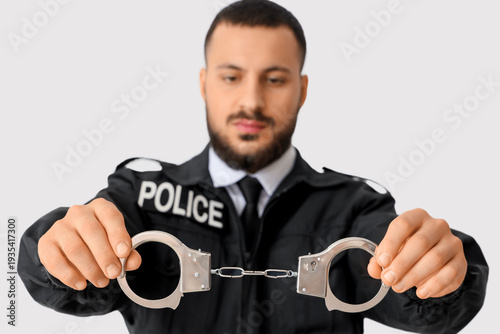 Male police officer with ha...