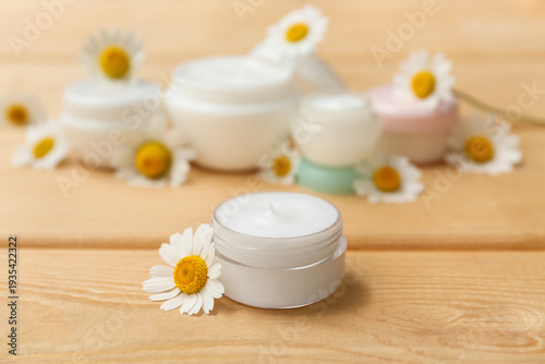 Jars of chamomile cosmetic ...