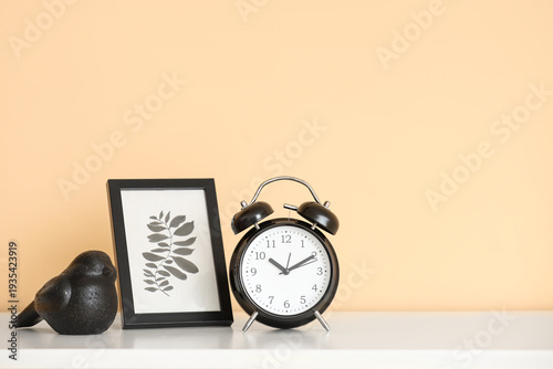 Black alarm clock with pict...