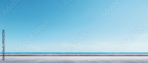 Minimalist Ocean Horizon View with Concrete Promenade and Blue Sky