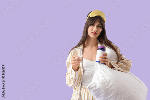 Young woman in pajamas with...