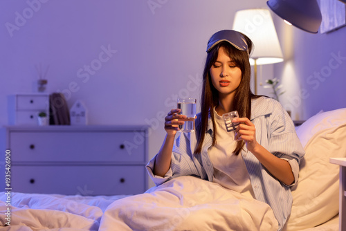 Young woman taking sleeping...