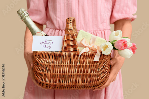 Young woman holding basket ...