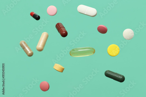 Flying colorful pills on tu...