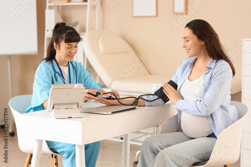 Young pregnant woman with d...