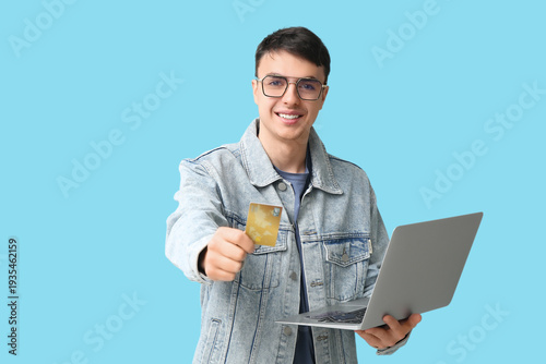 Young man with credit card ...