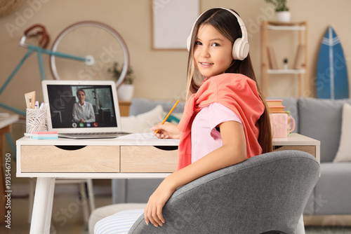 Happy teenage Asian girl in...