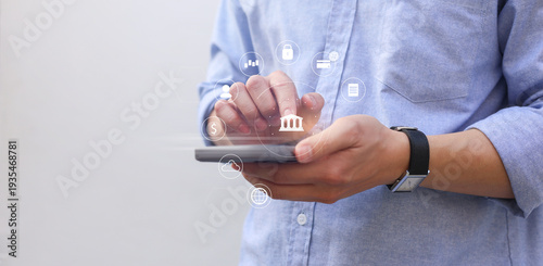 businessman hand hold smartphone and use private banking account application to using system function about checking stock market or transfer money worldwide for future tech concept