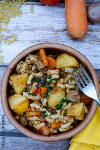 Hearty beef goulash stew with pasta and vegetables