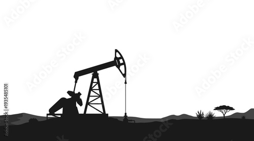 Oil pumpjack silhouette in arid landscape with sparse vegetation