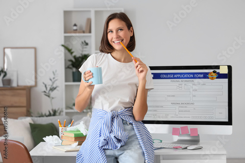 Teenage girl with coffee cu...