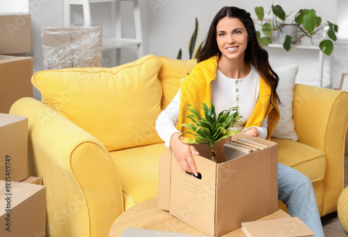 Beautiful woman with box of...