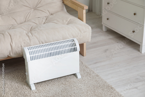 Electric heater on floor ne...