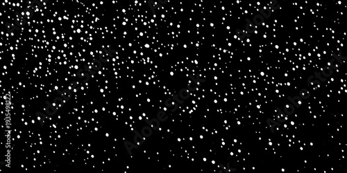 Abstract pattern of scattered white dots against a black background