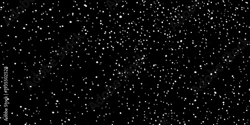 A dark background speckled with numerous small bright white dots