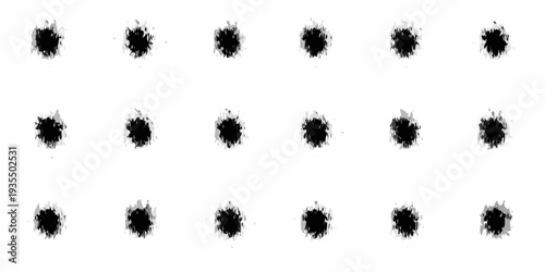 Arrangement of black irregular splatters on a stark white background
