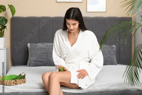 Beautiful young woman using...