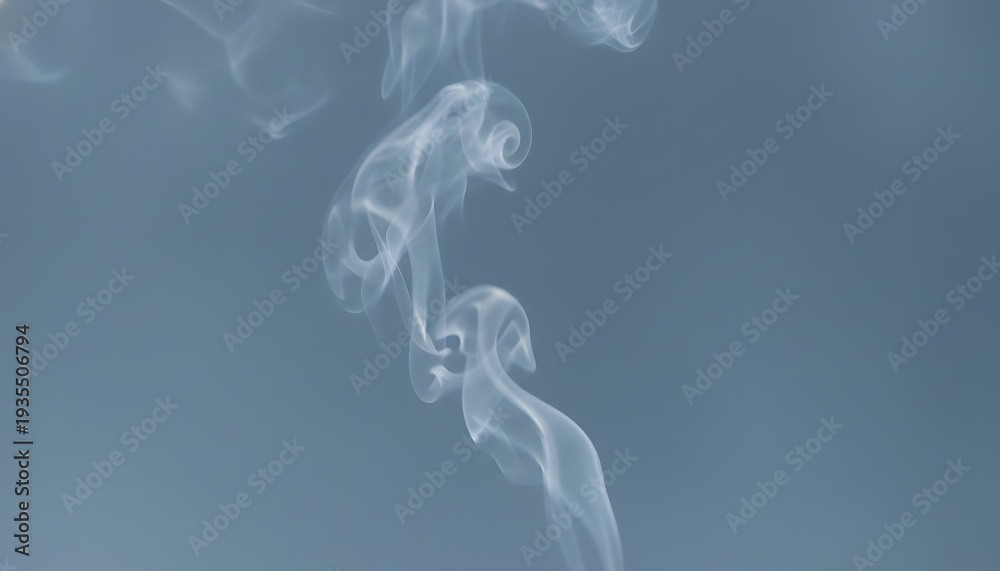 Fototapeta premium Elegant white smoke rising gracefully, creating abstract patterns and ethereal wisps against a serene background