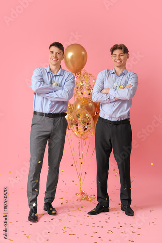 Young men in prom suits wit...