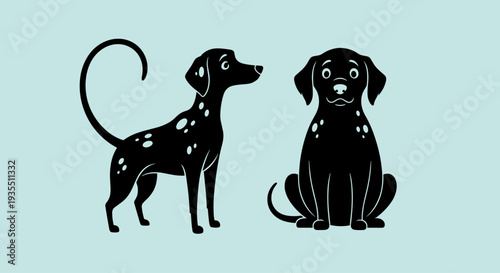 Two Black Dogs Standing and Sitting.