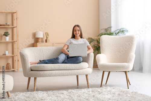 Young happy woman lying on ...