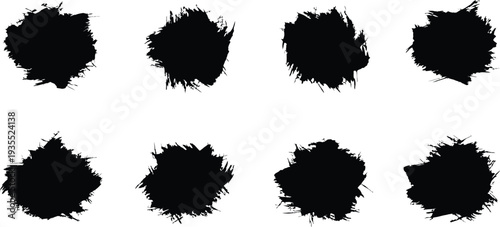 Collection of eight black ink blots on white background