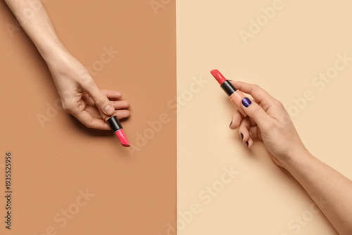 Female hands with lipsticks...