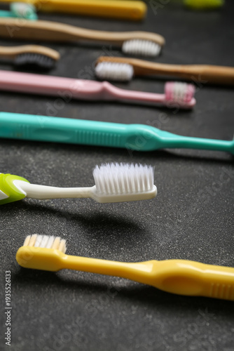 Toothbrushes on black grung...