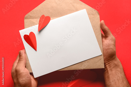 Male hands with envelope, b...