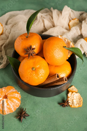 Bowl of sweet mandarins wit...
