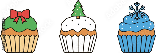 Three festive cupcakes decorated for winter holidays with Christmas tree and snowflake