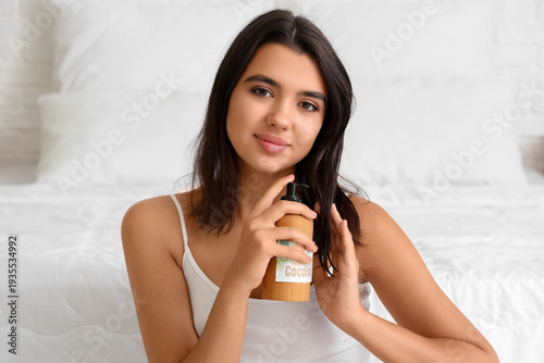 Pretty young woman applying...