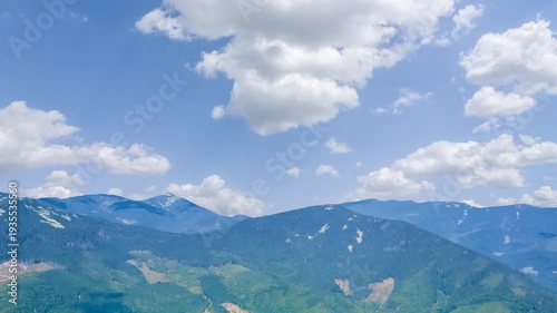 green mountains in a blue mist time lapse scene