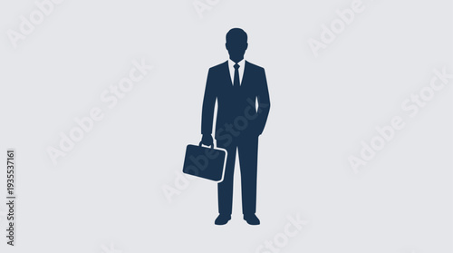 Businessman holding briefcase standing confidently.