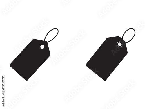 Two black blank price tags with strings on white background for labeling and identification purposes