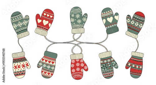 Collection of different pairs of patterned winter mittens in various colors and designs hanging on thin dark strings.