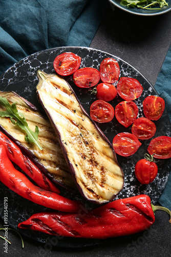 Board with tasty grilled ve...