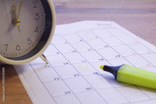 Photos notebook, alarm clock, and school supplies concept of education and school