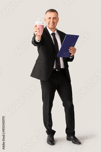 Mature businessman with gla...