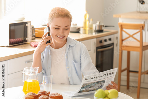 Young woman with newspaper ...