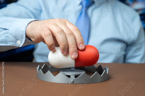 Slika na platnu A man inserts a medication capsule into a trap