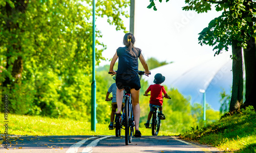 Cyclists ride on the bike path in the city Park