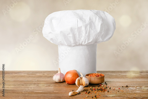 Chef's hat and spices on ta...